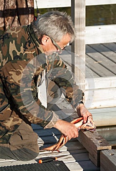 Cleaning a Brookie at the Fishing Dock