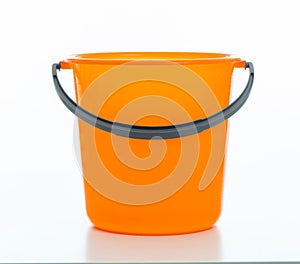 Cleaning bucket orange color isolated against white background