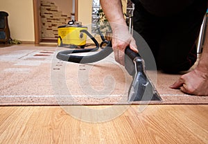 Cleaning carpet services detail with yellow machine