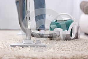 Cleaning carpet with vaccum cleaner