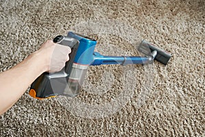 Cleaning carpet with vacuum cleaner
