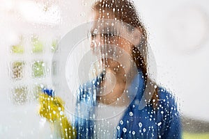 Cleaning - cleaning window pane with detergent