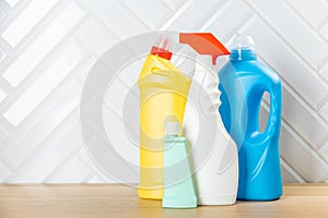 Cleaning concept. Set of cleaning detergents in colored plastic bottles. Clean house