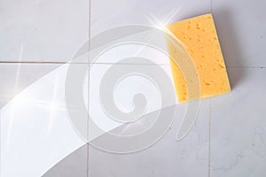 Cleaning concept trace sponge on a dirty wall tiles