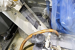 Cleaning contaminated components and assemblies with washing liquid under pressure on a CNC milling machine photo