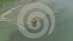 Cleaning and deepening by a dredger on the river. Philippines, Luzon