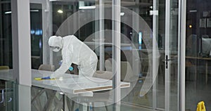 Cleaning, disinfection and person with hazmat suit in laboratory for germs, virus exposure or prevent infection