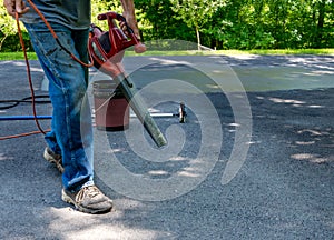 Cleaning driveway with air blower