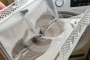 Cleaning the dryer filter. Dryer filter, retains dust and dirt.