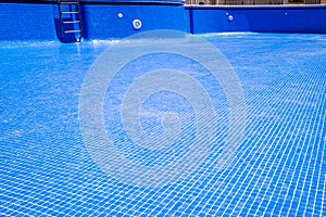 Cleaning an empty swimming pool in a residential