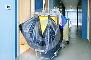 Cleaning equipment cart in hotel  corridor. C