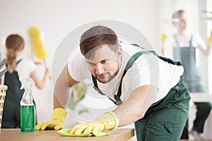 Cleaning expert washing the table