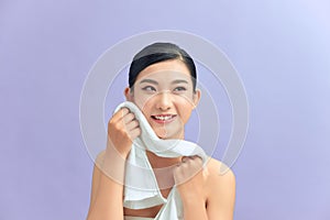 Cleaning Face Skin. Closeup Portrait Of Beautiful Happy Smiling Girl Holding Clean White Towel Near Facial Skin After Washing Face