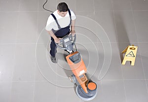 Cleaning floor with machine
