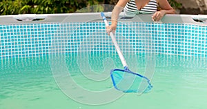 Cleaning frame pool with a skimmer net. Pool maintenance process