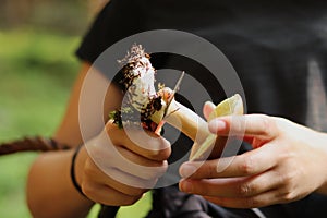 Cleaning the fungus from mycelium. Mushroomer cleans stem from clay, earth. Cuts xerocomus subtomentosus after take from land.