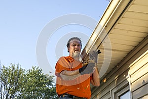 Cleaning Gutters On A Hot Day