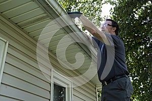 Cleaning Gutters On A Residential Home