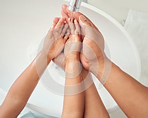 Cleaning, hand and water with a girl and father in the bathroom of their home together. Children, kids and hygiene with