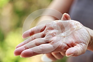 Woman using rubbing alcohol
