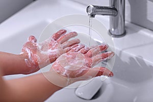 Cleaning hands. Soap in hands for cleaning. Hand hygiene Close u