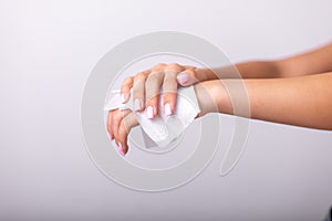 Cleaning hands with wet wipes, light pink nails, prevention of infectious diseases, corona19