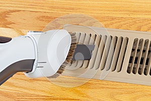 Cleaning heater vent withVacuum photo