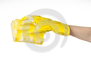 Cleaning the house and sanitation topic: Hand holding a yellow s