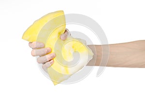 Cleaning the house and sanitation topic: Hand holding a yellow s