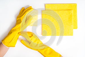 Cleaning the house and sanitation topic: Hand holding a yellow sponge wet with foam isolated on a white background in