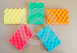 Cleaning kit and cleaning bathroom and kitchen, colorful sponges, the concept of spring cleaning
