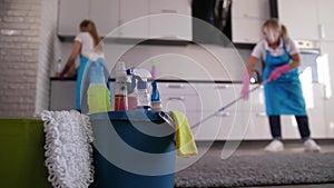 Cleaning ladies working in house kitchen