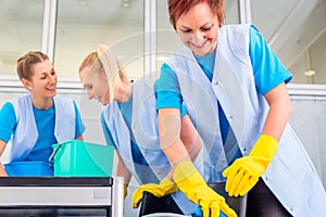 Cleaning ladies working in office