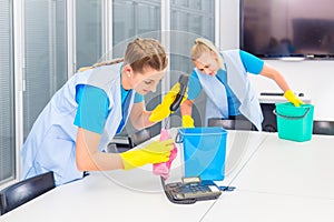 Cleaning ladies working in office