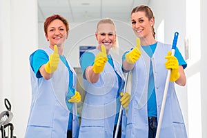 Cleaning ladies working in team