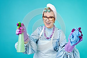 Cleaning Lady Fun. Elderly funny housewife fooling around with a broom. Full body isolated. Comical cleaning lady, old