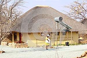 Cleaning black lady luxury hotel resort, Namibia