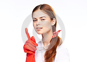 cleaning lady in red rubber gloves posing fun light background