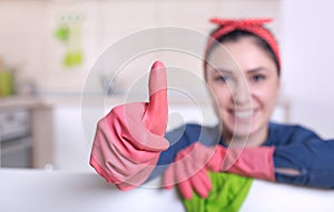 Cleaning lady showing thumb up