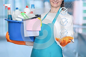 Cleaning lady shows in her hand a list of completed cleaning work