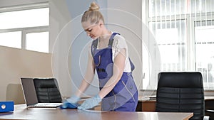 Cleaning lady tries to scrub the dirt.