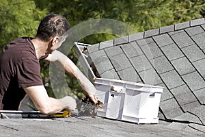 Cleaning leaves from the roof gutter