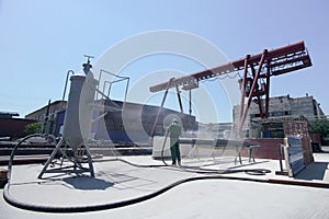 Cleaning of the metal by sandblasting photo