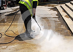Cleaning the pavement of the street with pressurized water photo