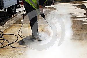 Disinfection coronavirus, Cleaning the pavement of the street with pressurized water photo