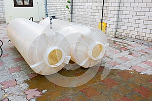 Cleaning plastic tanks volume of one cubic meter of drinking water, dirty rusty sediment