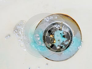 Cleaning plug hole with chemicals photo