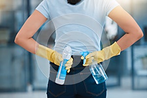 Cleaning, product and back of woman with spray bottle for hygiene, disinfection and sanitization in office. Cleaning