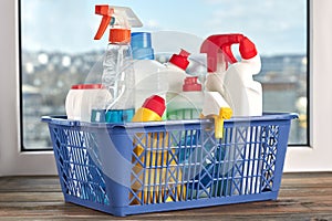 Cleaning products and supplies in a basket.