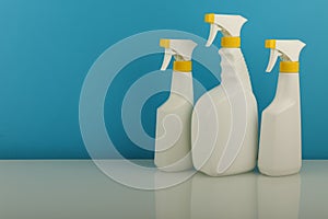 Cleaning products in white spray bottles